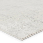 A plain gray area rug with no visible patterns or textures.