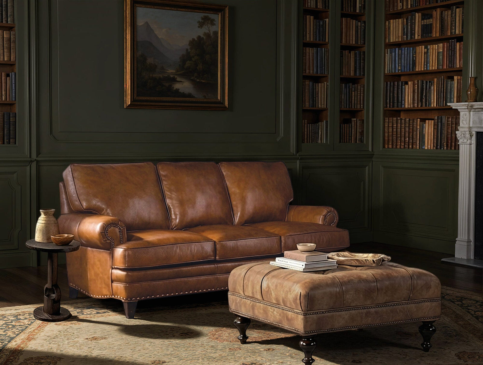 Brown leather sofa and ottoman in a room with bookshelves and a painting on the wall.