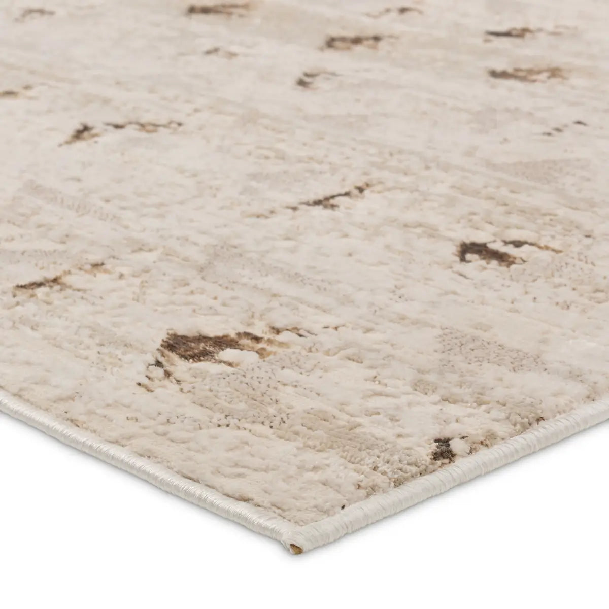 Close-up of a textured beige rug with brown accents on a white background