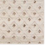 Patterned rug with geometric design on a beige background