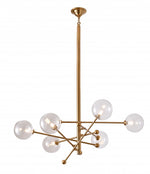 A modern brass chandelier with clear glass shades and adjustable rods, featuring a metal frame.