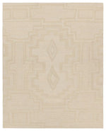 Beige area rug with a subtle pattern on a beige background