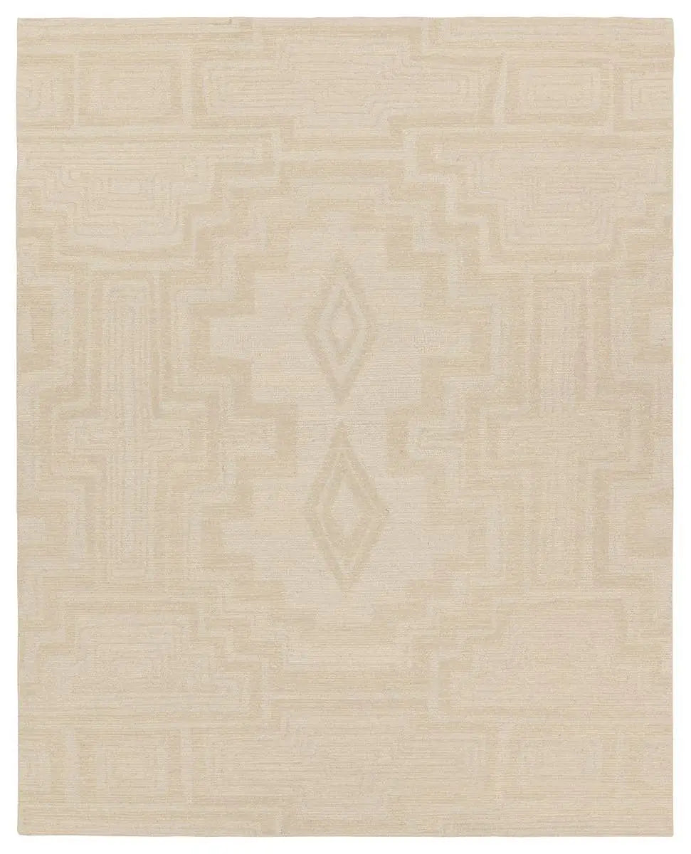 Beige area rug with a subtle pattern on a beige background