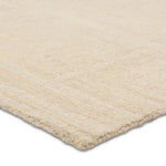 Beige rug corner on a white background