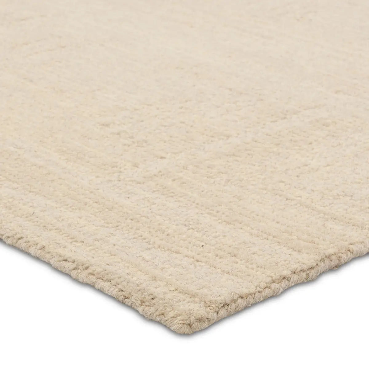 Beige rug corner on a white background