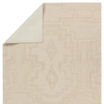 Beige area rug with geometric pattern on a white background