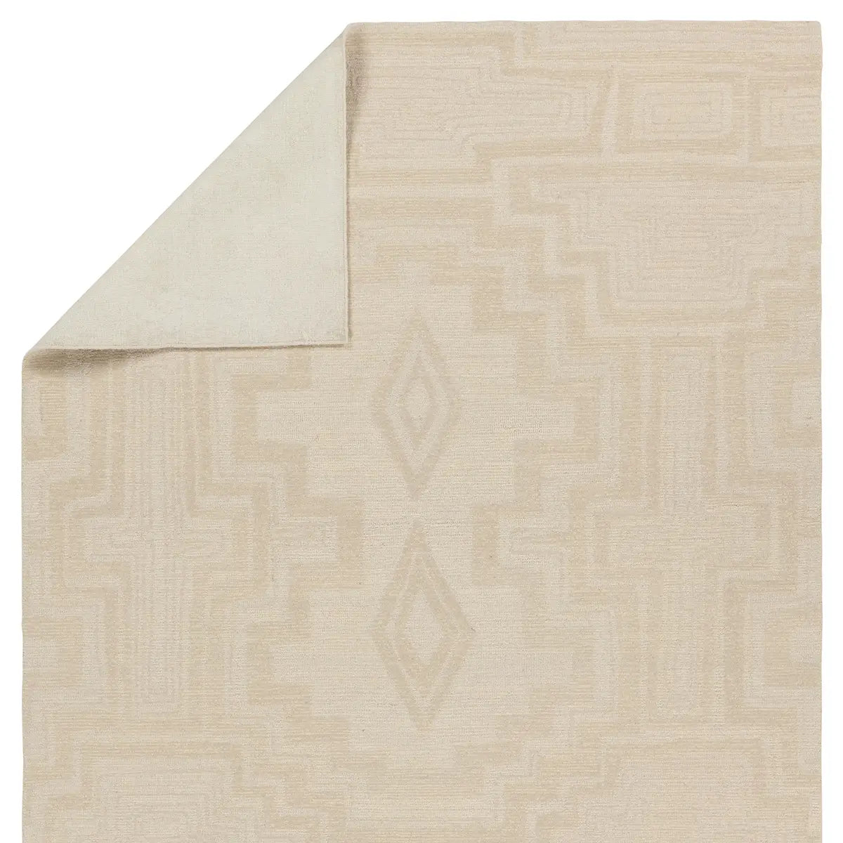 Beige area rug with geometric pattern on a white background