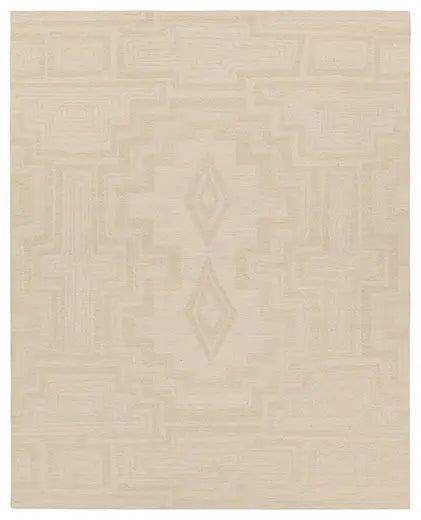 Beige area rug with geometric pattern on a plain background