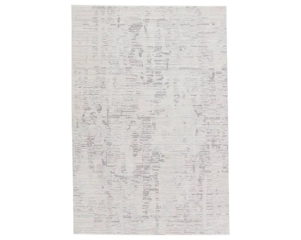 A rectangular area rug with a textured white design, featuring a subtle pattern.