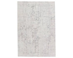 A rectangular area rug with a textured white design, featuring a subtle pattern.