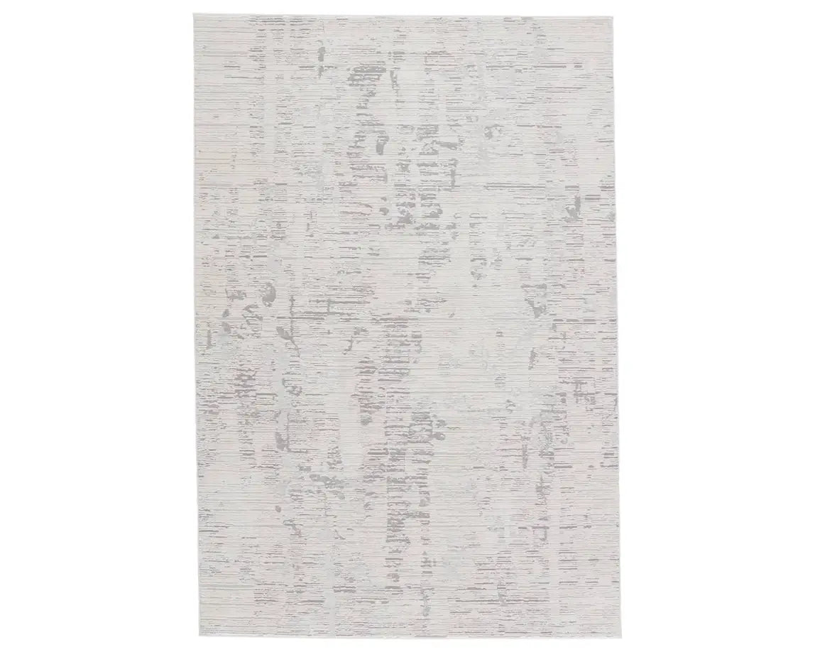 A rectangular area rug with a textured white design, featuring a subtle pattern.