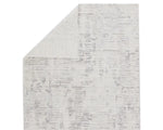 A rectangular area rug with a textured white design, featuring a subtle pattern.