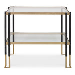 Two-tiered glass table with black and gold frame on a white background