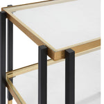 Glass table with gold and black metal frame on a white background