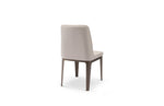A beige upholstered dining chair with a high backrest and a straight seat type, isolated on a white background.