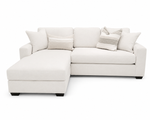 A light cream or off-white upholstered sectional sofa with a left-facing chaise lounge, styled with four throw pillows including two striped accent pillows, set against a plain white background.
