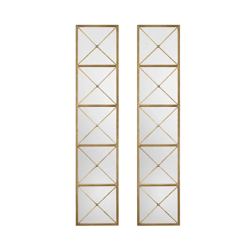 Two vertical decorative brass mirrors with a geometric pattern in a antique gold finish.