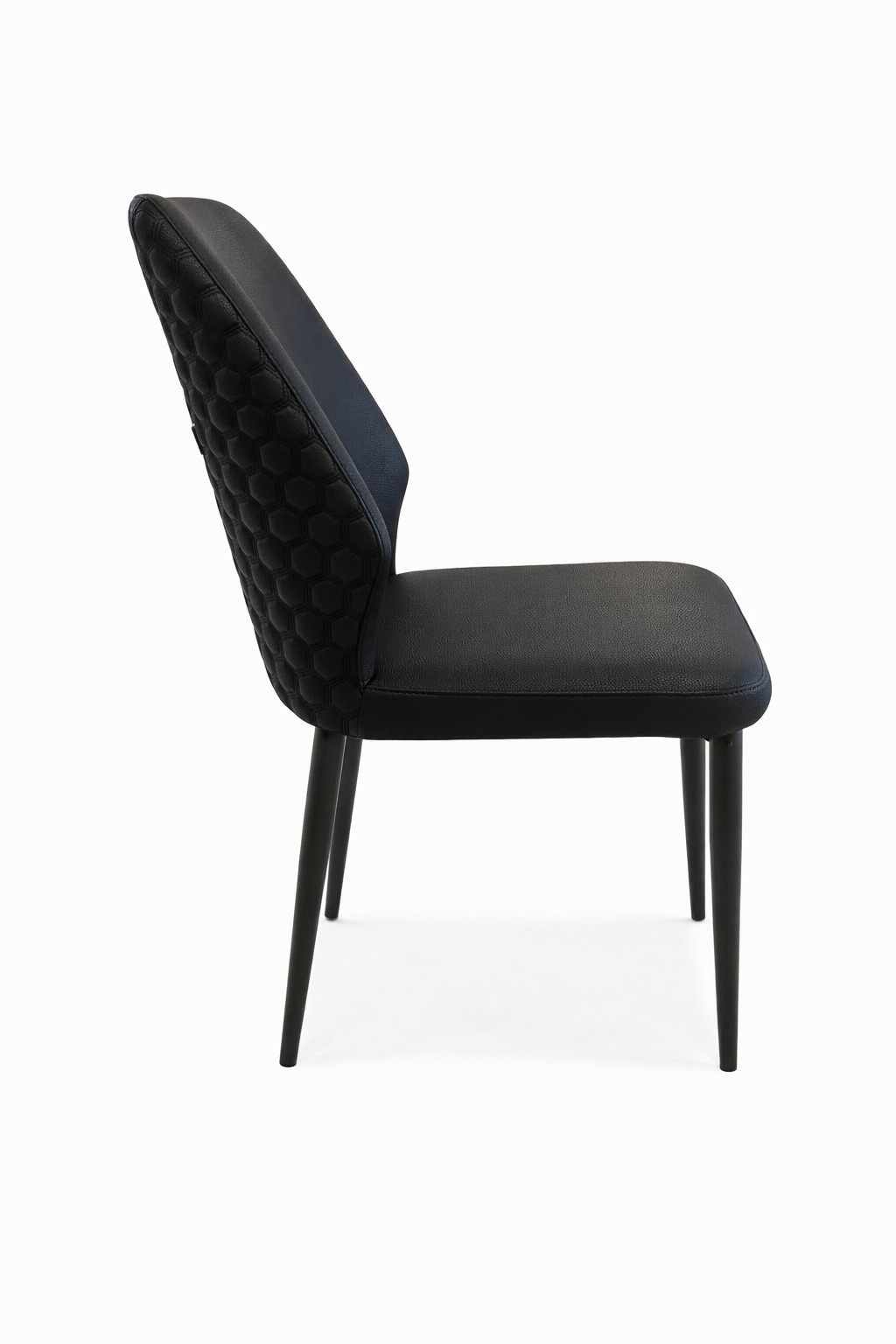 Black upholstered chair with tufted backrest on a white background