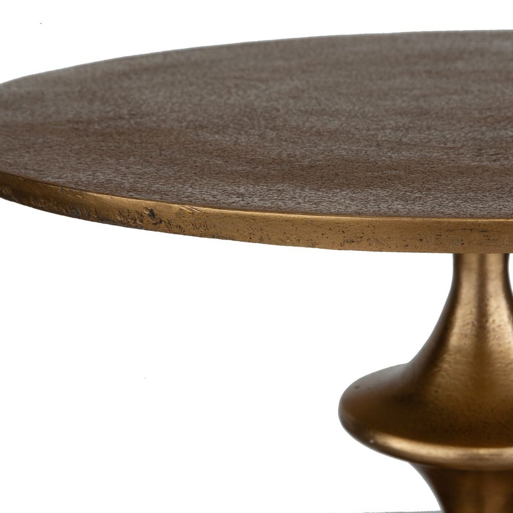 Round table with textured surface and bronze base on a white background