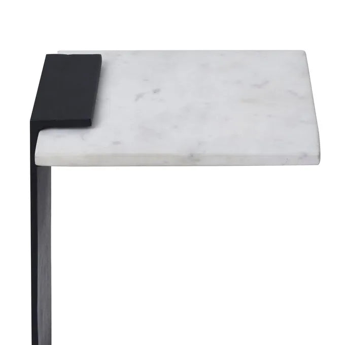 An end table with a black matte finish leg and a natural white marble top.