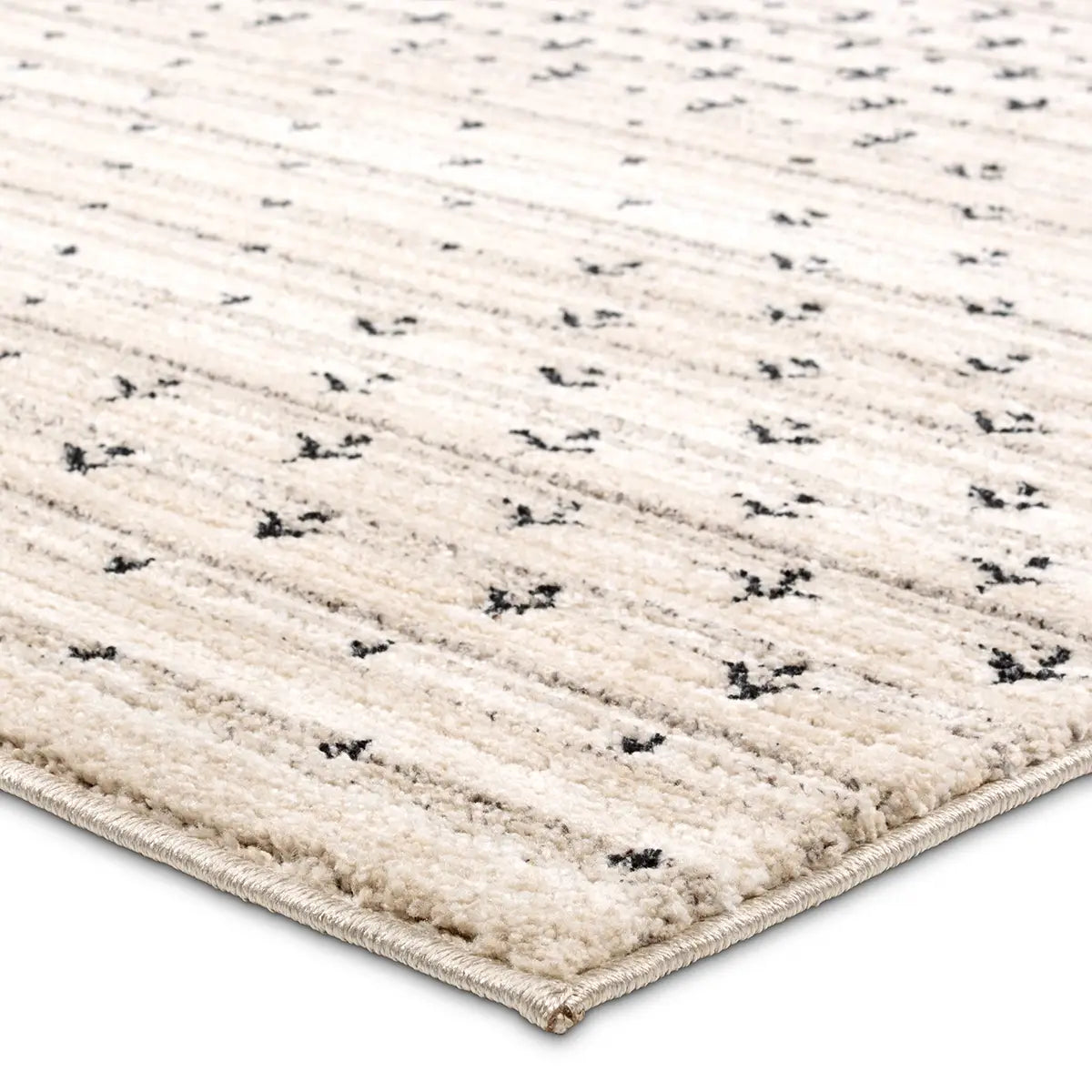 Beige rug with black pattern on a white background