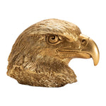 A decorative eagle-shaped object with a metallic gold finish.