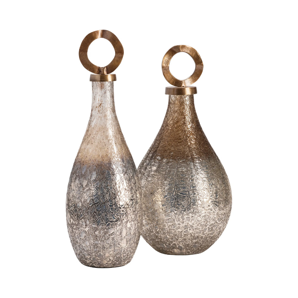 Two decorative vases with metallic finishes on a white background