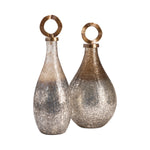 Two decorative vases with metallic finishes on a white background