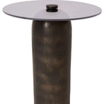 Side table with a glass top and bronze base on a white background