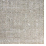 Textured beige rug with a subtle pattern