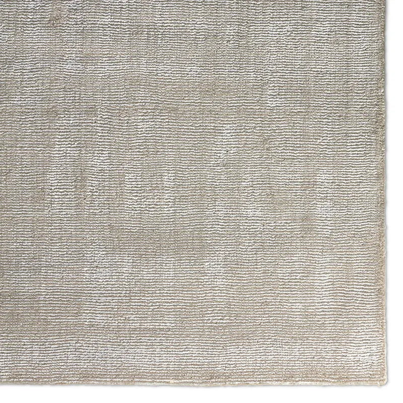 Textured beige rug with a subtle pattern