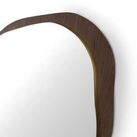 Wooden mirror with a wavy edge on a white background