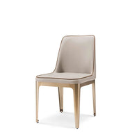 Beige chair with gold legs on a white background