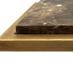 Close-up of a stone surface with a gold border