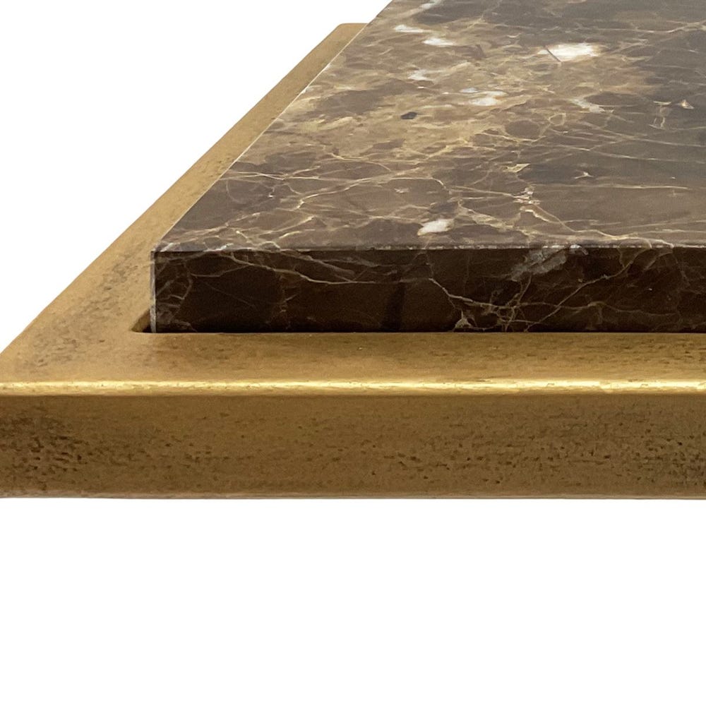 Close-up of a stone surface with a gold border