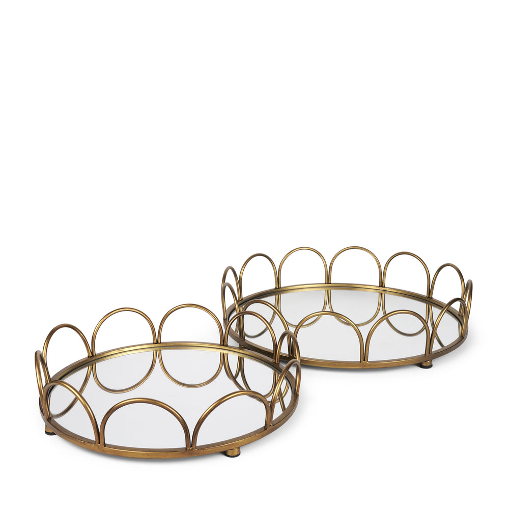 Two gold-colored metal serving trays with a geometric pattern.