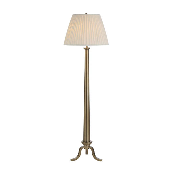 Floor lamp with a pleated beige shade on a white background