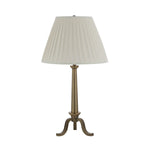 Table lamp with pleated white shade on a white background