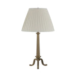 Table lamp with pleated beige shade on a white background
