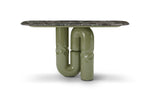 Table with a unique design featuring green metal pipes and a dark marble top on a white background