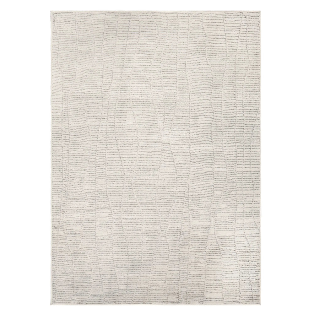 Textured area rug with a neutral color palette on a white background