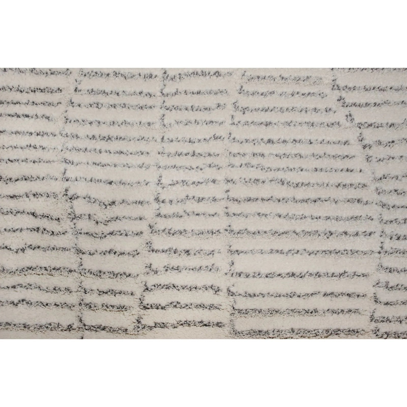 Textured area rug with a neutral color palette on a white background