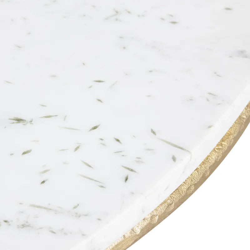 Close-up of a marble surface with gold trim