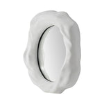 A large Organic form mirror with a white background