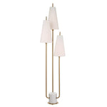 Three-tiered floor lamp with white lampshades on a white background