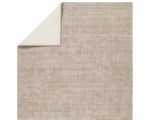 A rectangular taupe-colored area rug with a textured weave pattern.