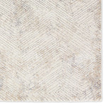 Textured area rug with geometric pattern on a plain background