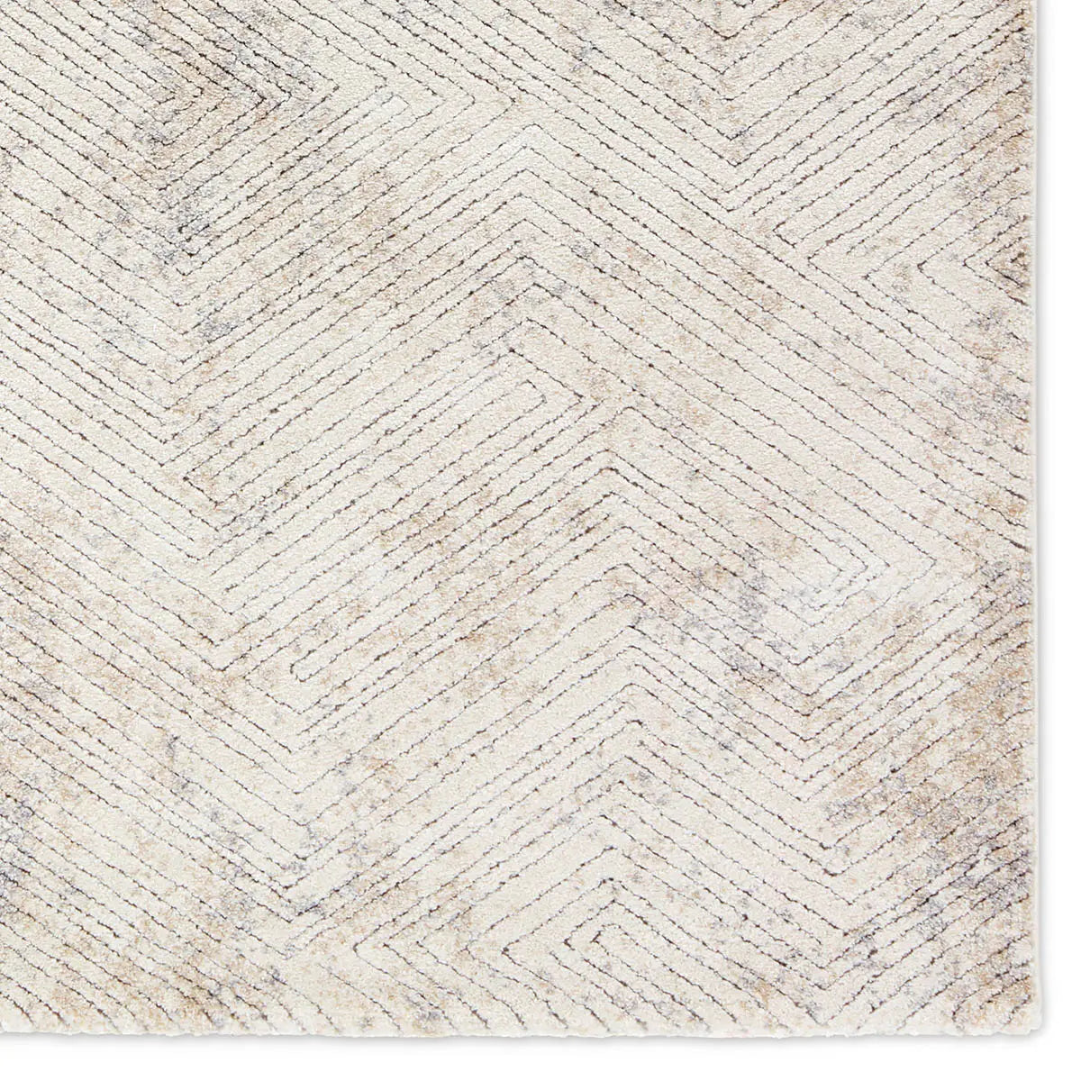 Textured area rug with geometric pattern on a plain background