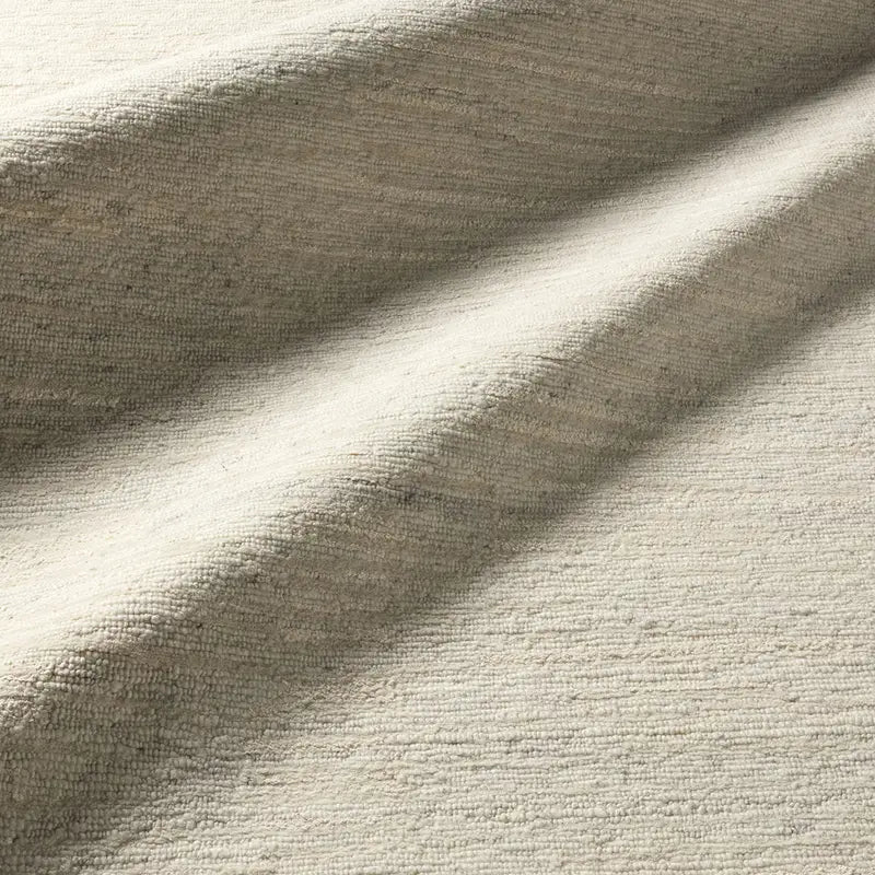 Close-up of beige fabric with texture and folds
