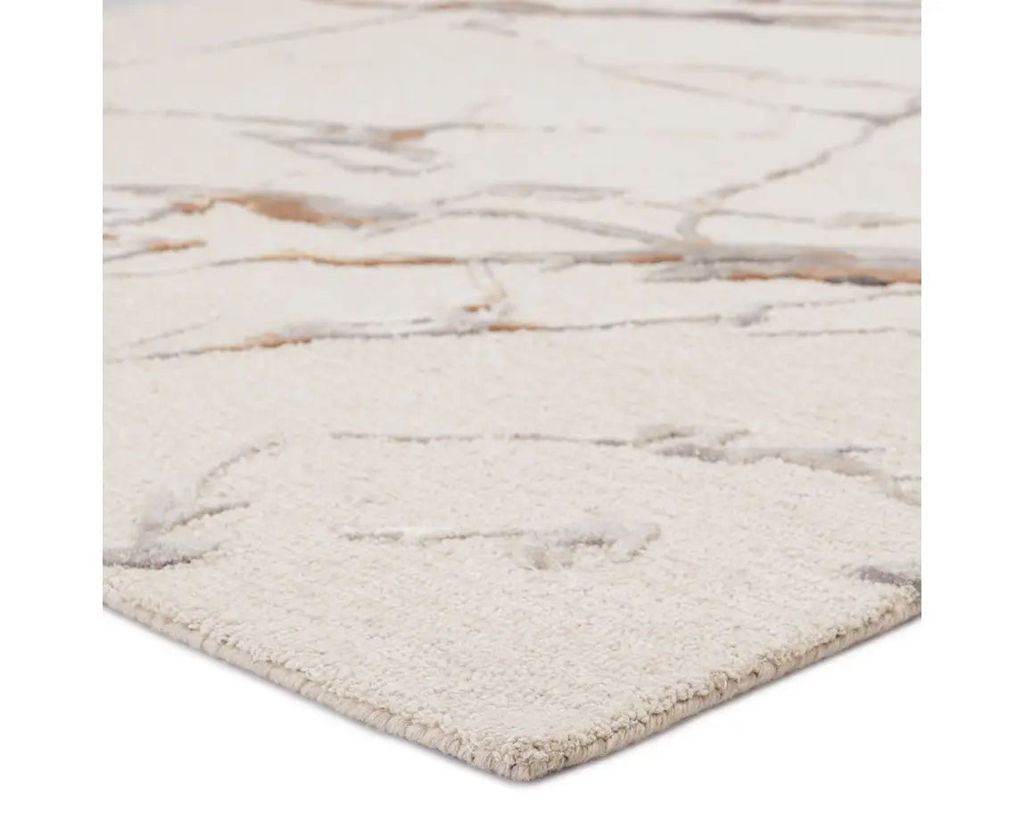 A rectangular area rug with a light gray color and a marble-like pattern, indicating a hand-tufted construction.